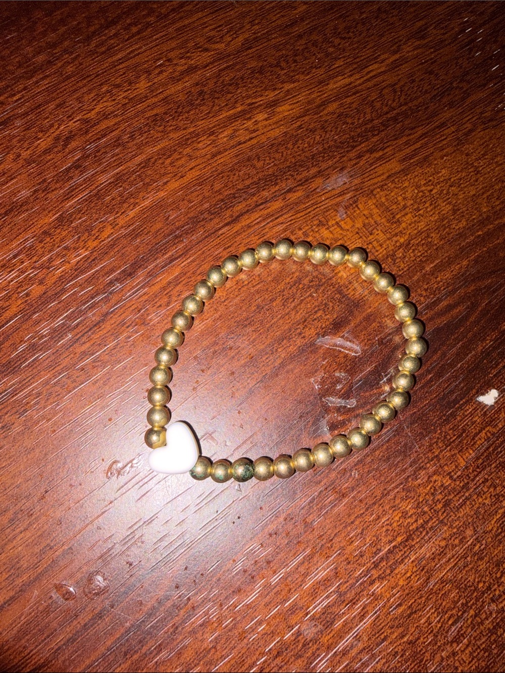 Gold Beaded Stretch Bracelet with White Heart Accent